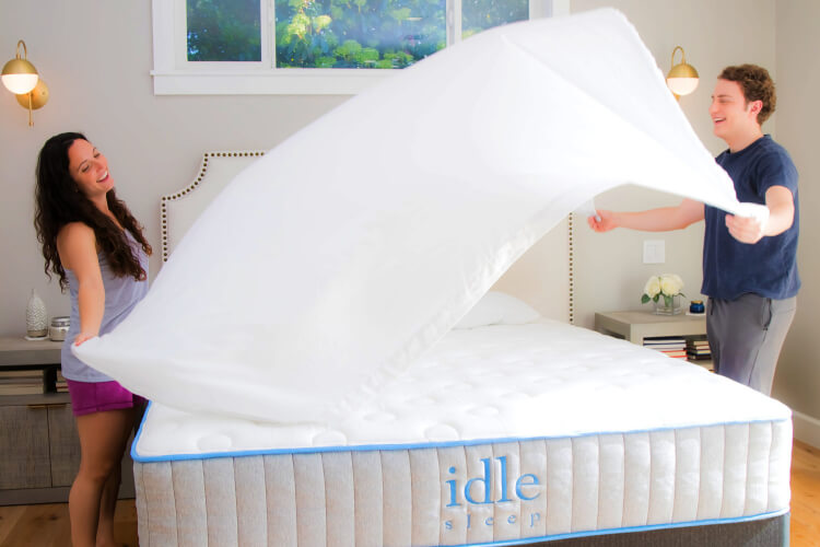 Couple dressing an Idle Sleep mattress