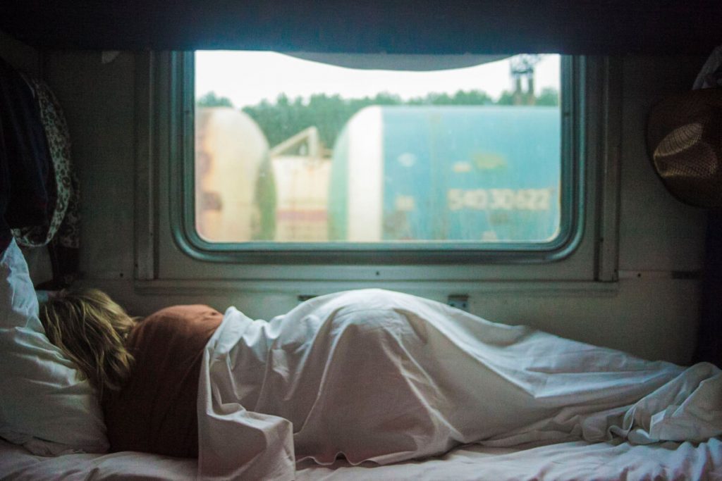 A person sleeping on an RV mattress